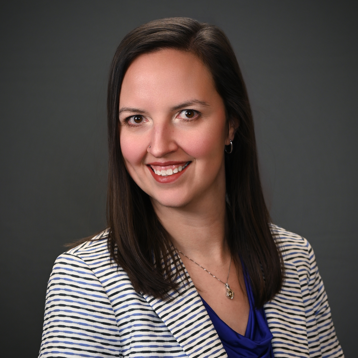 Headshot of Tiffany Rentsch, a professional pharmacist, with a friendly and approachable expression.