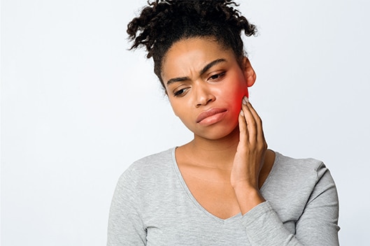 a woman in need of emergency dental care